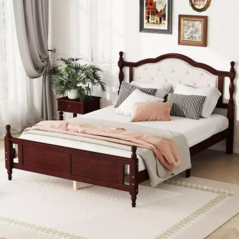 Pine Queen Bed feturing an Upholstered Headboard, Panel Footboard, and Supporting Feet